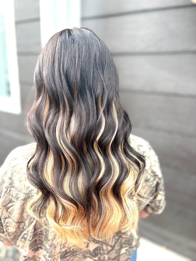 Dark hair with bright blonde ribbon highlights