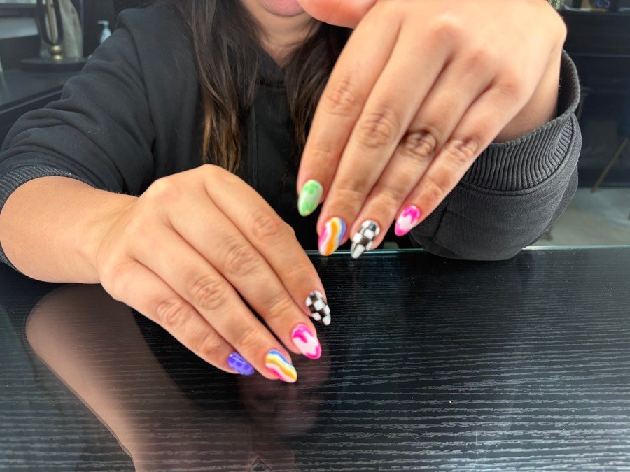 Rainbow swirl French tip nails