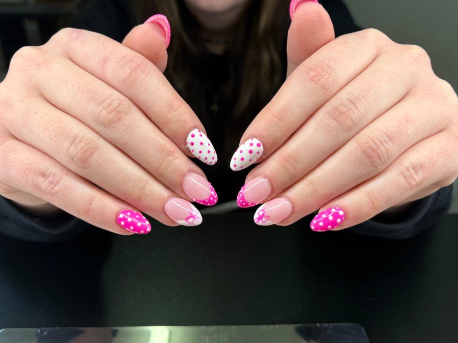Soft pink nails with white and pink dots
